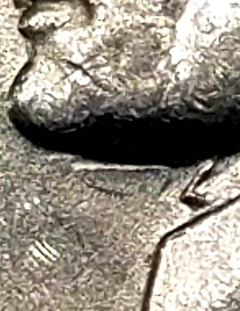 1976-D-Jefferson-Nickel-Tilted-Die-Strike-Under-Jaw-On-Obverse?